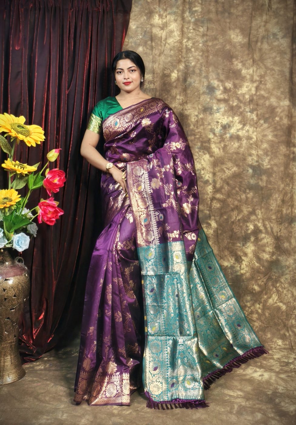Model wearing a purple and teal Banarasi silk saree